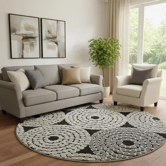 8' Black Beige And Ivory Geometric Washable Round Rug With UV Protection Photo 1