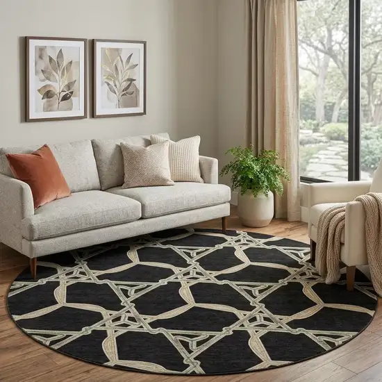 8' Black Beige And Ivory Geometric Washable Round Rug With UV Protection Photo 1