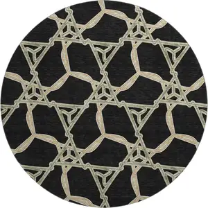 Photo of 8' Black Beige And Ivory Geometric Washable Round Rug With UV Protection