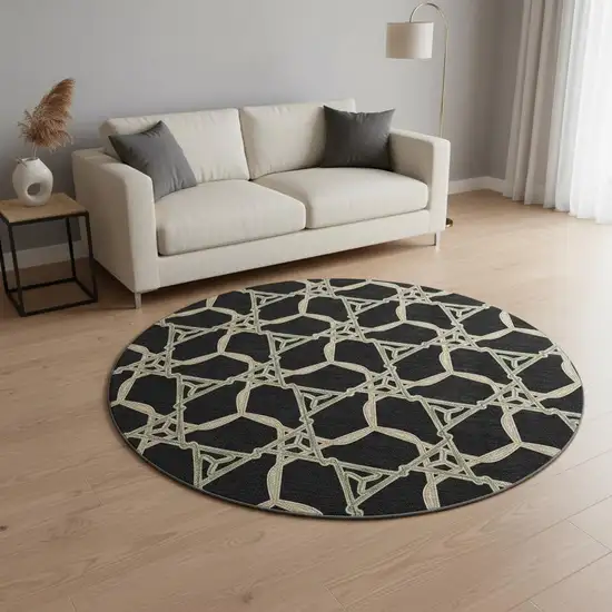 8' Black Beige And Ivory Geometric Washable Round Rug With UV Protection Photo 2