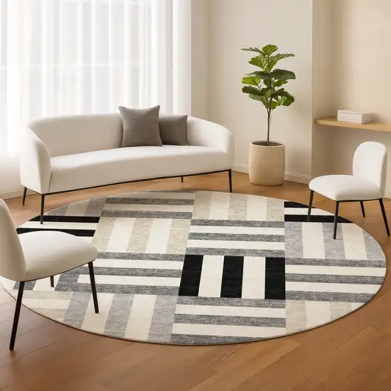 8' Black Beige And Ivory Round Geometric Washable Indoor Outdoor Area Rug Photo 9