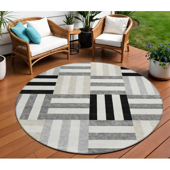 8' Black Beige And Ivory Round Geometric Washable Indoor Outdoor Area Rug Photo 1