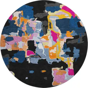 Photo of 8' Black Blue Yellow And Pink Abstract Washable Round Rug With UV Protection