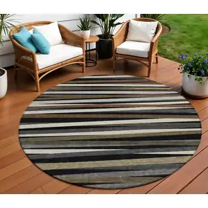 Photo of 8' Black Brown And Ivory Round Striped Washable Indoor Outdoor Area Rug