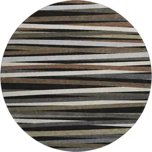 Photo of 8' Black Brown And Ivory Striped Washable Round Rug With UV Protection