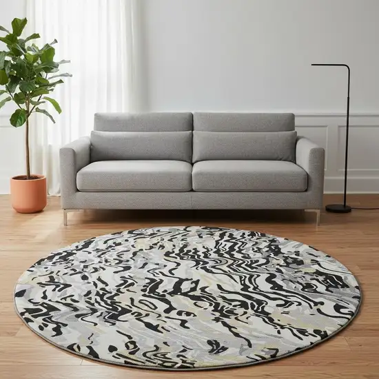 8' Black Gold And Ivory Abstract Washable Round Rug With UV Protection Photo 2