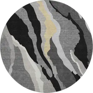 Photo of 8' Black Gold And Ivory Abstract Washable Round Rug With UV Protection