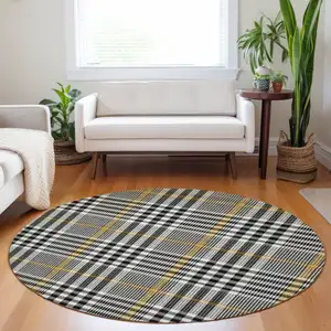 Photo of 8' Black Gold And Ivory Round Plaid Washable Indoor Outdoor Area Rug