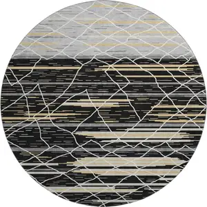Photo of 8' Black Gold And Ivory Striped Washable Round Rug With UV Protection