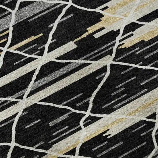 8' Black Gold And Ivory Striped Washable Round Rug With UV Protection Photo 7