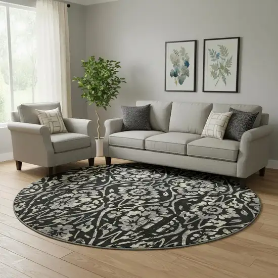 8' Black Gray And Beige Floral Washable Round Rug With UV Protection Photo 1