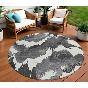 Photo of 8' Black Gray And Charcoal Round Abstract Washable Indoor Outdoor Area Rug