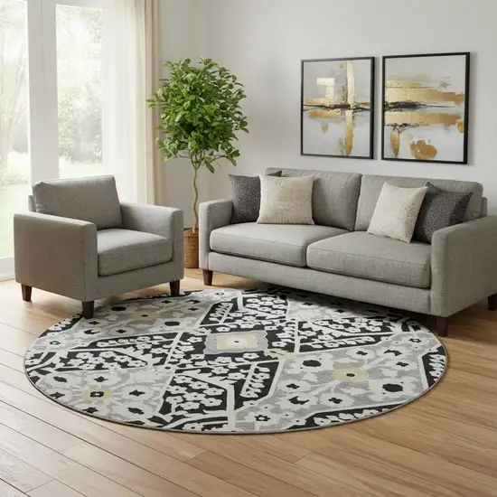 8' Black Gray And Gold Floral Washable Round Rug With UV Protection Photo 1