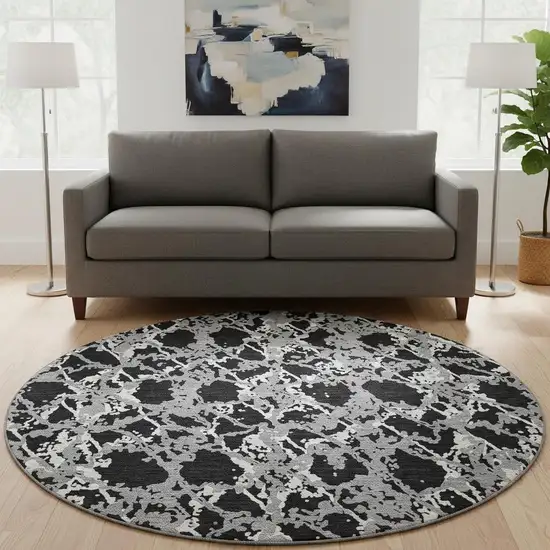 8' Black Gray And Ivory Abstract Washable Round Rug With UV Protection Photo 2