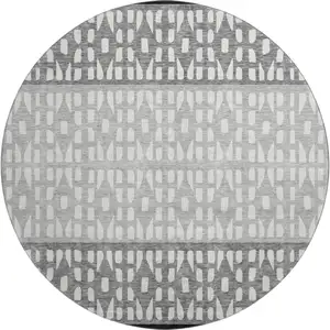 Photo of 8' Black Gray And Ivory Geometric Washable Round Rug With UV Protection