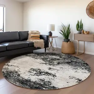 Photo of 8' Black Gray And Ivory Round Abstract Washable Indoor Outdoor Area Rug