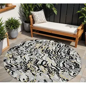 Photo of 8' Black Gray And Ivory Round Abstract Washable Indoor Outdoor Area Rug