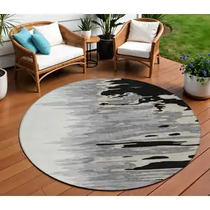 Photo of 8' Black Gray And Ivory Round Abstract Washable Indoor Outdoor Area Rug