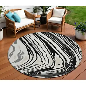 Photo of 8' Black Gray And Ivory Round Abstract Washable Indoor Outdoor Area Rug