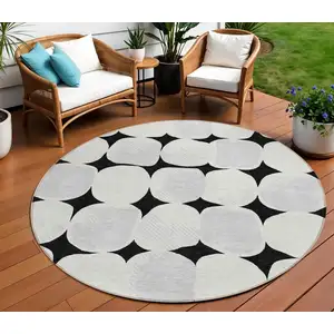 Photo of 8' Black Gray And Ivory Round Abstract Washable Indoor Outdoor Area Rug