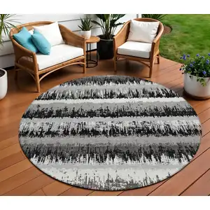 Photo of 8' Black Gray And Ivory Round Striped Washable Indoor Outdoor Area Rug