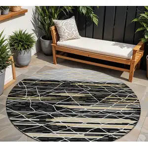 Photo of 8' Black Gray And Ivory Round Striped Washable Indoor Outdoor Area Rug
