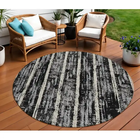 8' Black Gray And Ivory Round Striped Washable Indoor Outdoor Area Rug Photo 1