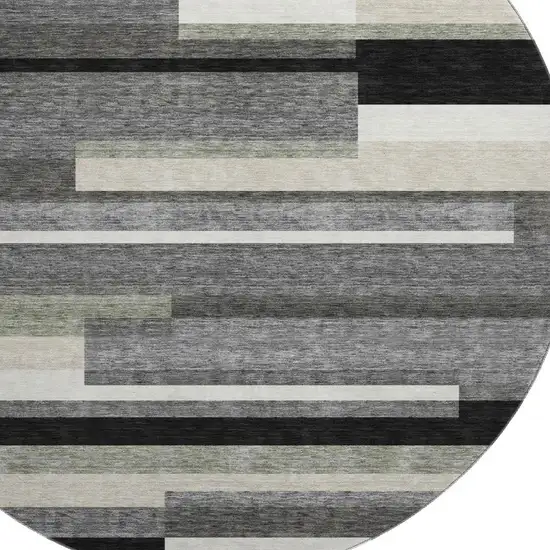 8' Black Gray And Ivory Striped Washable Round Rug With UV Protection Photo 3