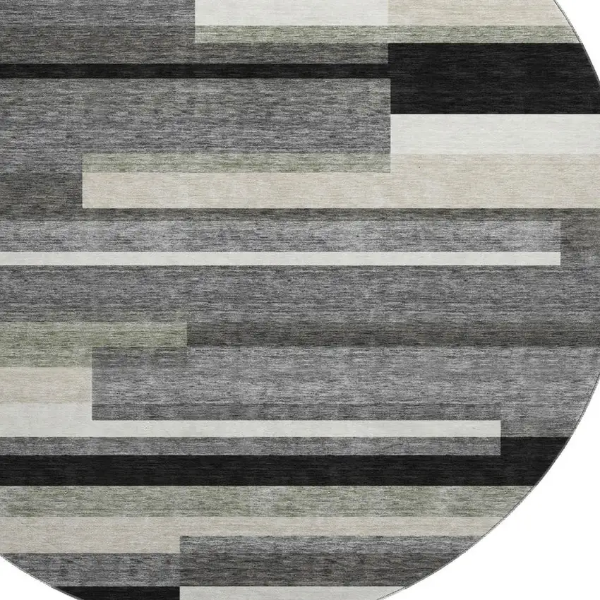 8' Black Gray And Ivory Striped Washable Round Rug With UV Protection Photo 3