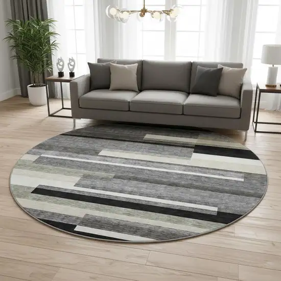 8' Black Gray And Ivory Striped Washable Round Rug With UV Protection Photo 2