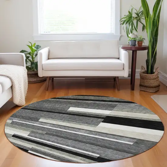 8' Black Gray And Ivory Striped Washable Round Rug With UV Protection Photo 5