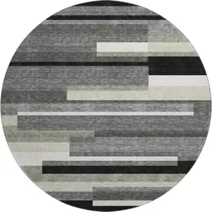 Photo of 8' Black Gray And Ivory Striped Washable Round Rug With UV Protection