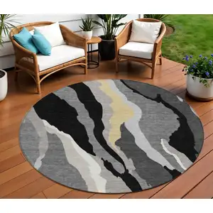 Photo of 8' Black Gray And Tan Round Abstract Washable Indoor Outdoor Area Rug