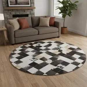 Photo of 8' Black Ivory And Beige Patchwork Washable Round Rug With UV Protection