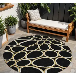 Photo of 8' Black Ivory And Beige Round Abstract Washable Indoor Outdoor Area Rug