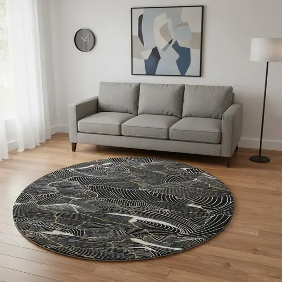 8' Black Ivory And Gold Abstract Washable Round Rug With UV Protection Photo 2