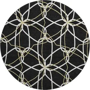 Photo of 8' Black Ivory And Gold Geometric Washable Round Rug With UV Protection
