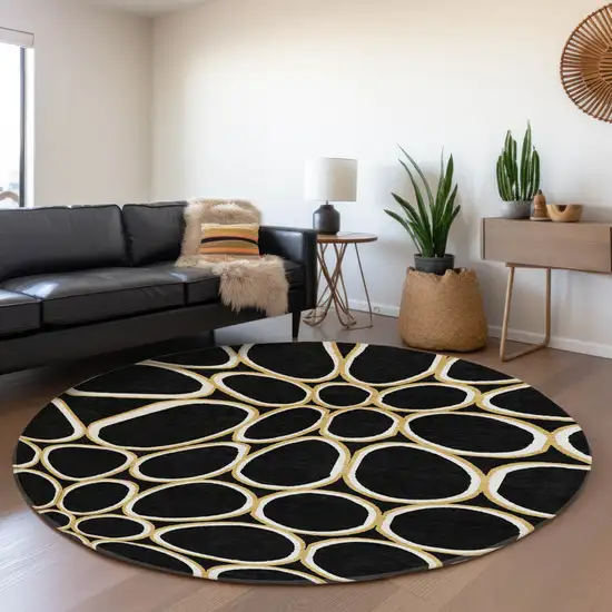 8' Black Ivory And Gold Geometric Washable Round Rug With UV Protection Photo 4