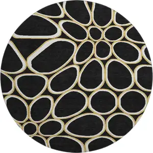 Photo of 8' Black Ivory And Gold Geometric Washable Round Rug With UV Protection