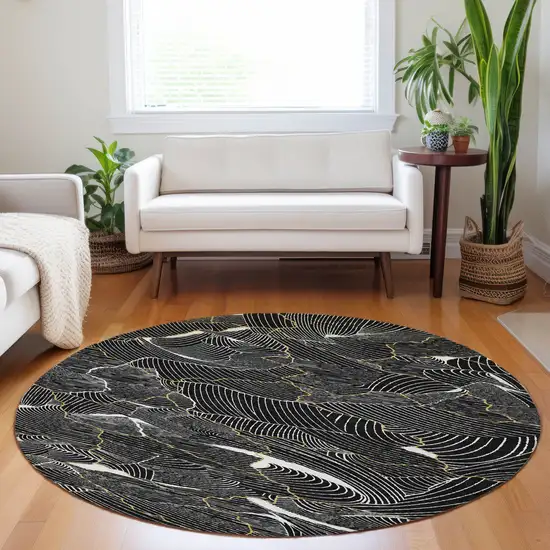 8' Black Ivory And Gold Round Abstract Washable Indoor Outdoor Area Rug Photo 9
