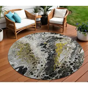 Photo of 8' Black Ivory And Gold Round Abstract Washable Indoor Outdoor Area Rug