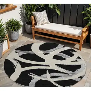Photo of 8' Black Ivory And Gray Round Abstract Washable Indoor Outdoor Area Rug