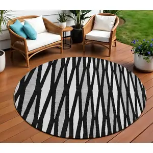 Photo of 8' Black Ivory And Gray Round Geometric Washable Indoor Outdoor Area Rug