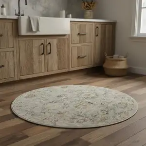 Photo of 4' Black Mint Green And Ivory Floral Distressed Round Rug