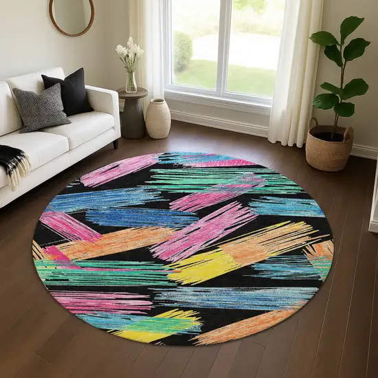 8' Black Pink And Yellow Striped Washable Round Rug With UV Protection Photo 4