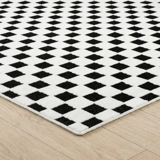 10' Black and White Geometric Distressed Indoor Outdoor Runner Rug Photo 3