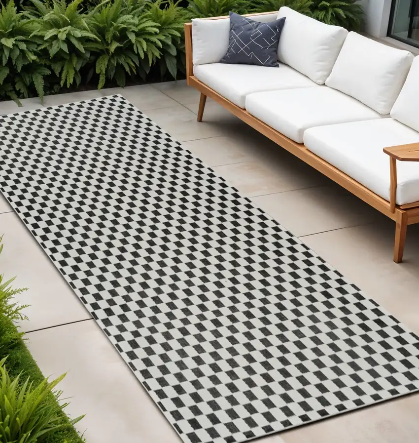10' Black and White Geometric Distressed Indoor Outdoor Runner Rug Photo 1