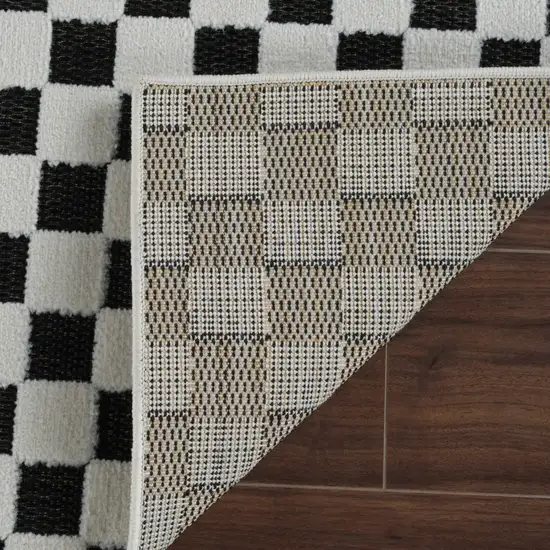 8' Black and White Geometric Distressed Indoor Outdoor Runner Rug Photo 7