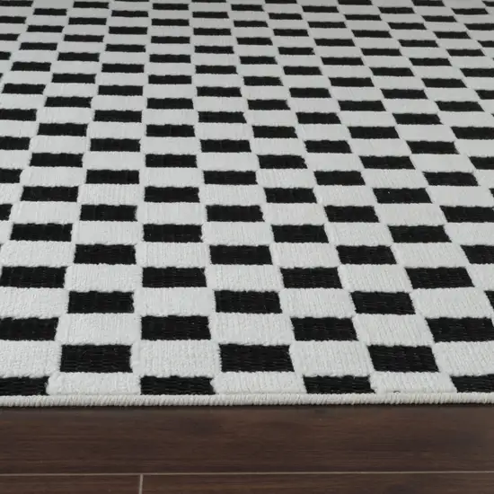 8' Black and White Geometric Distressed Indoor Outdoor Runner Rug Photo 5