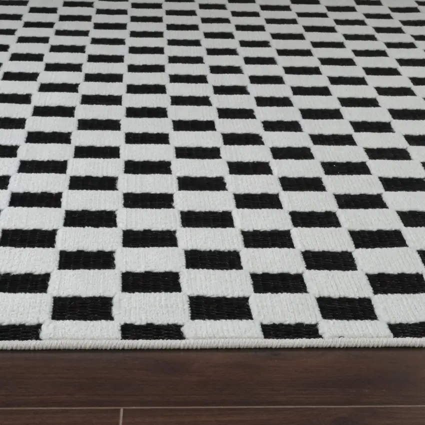 8' Black and White Geometric Distressed Indoor Outdoor Runner Rug Photo 5